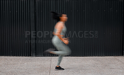 Buy stock photo Speed, running and woman with fitness, training and wellness with challenge in city. New York, blur or athlete with practice, exercise or outdoor with workout routine, cardio or sports with endurance