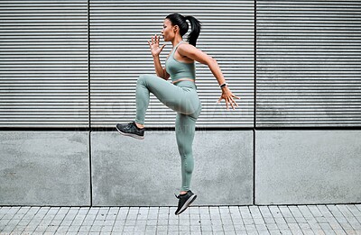 Buy stock photo Athlete, woman and running for exercise outdoor with fitness, sports training and energy of health workout. Active, girl and jumping with cardio performance, endurance progress and marathon practice