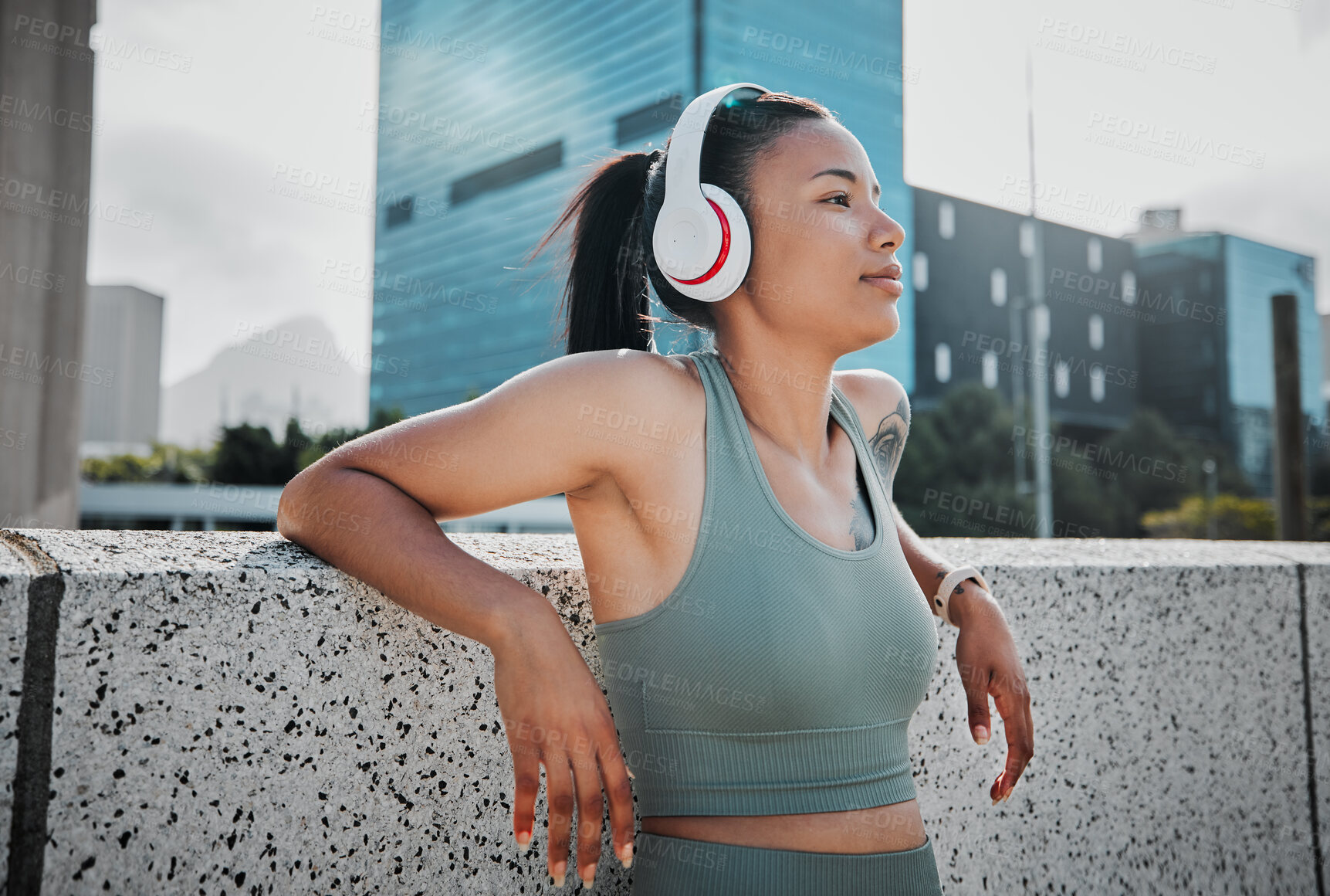 Buy stock photo Fitness, girl and relax with headphones in city for exercise break, listening to music or thinking of workout progress. Athlete, runner or happy woman in urban town for morning jog or cardio training