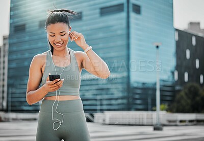 Buy stock photo Woman, fitness and phone outdoor for music, exercise and health with earphones, smile and workout. Athlete, mobile and streaming app in city for training, sports and radio with healthy cardio run