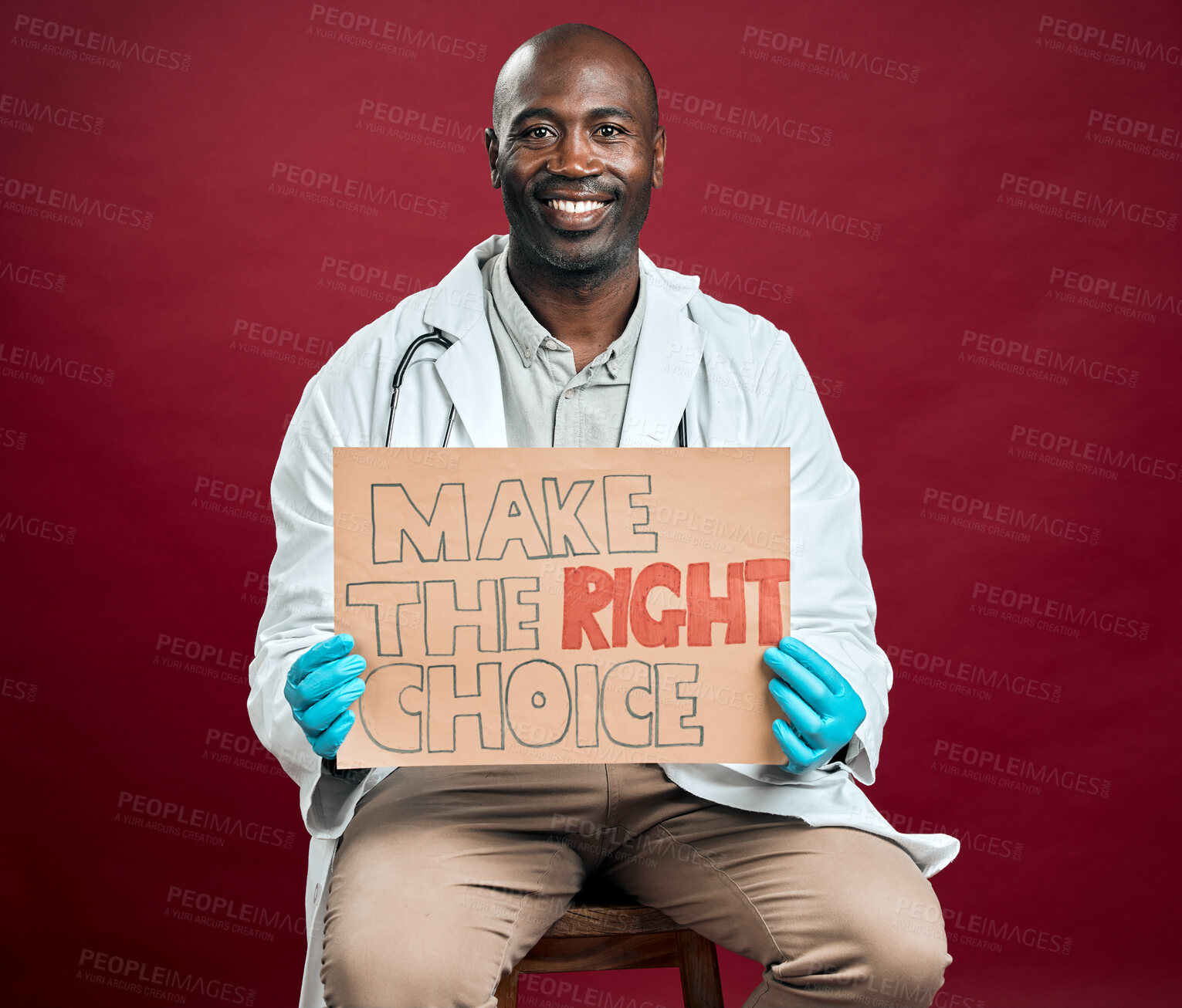 Buy stock photo Portrait, doctor and vaccine poster in studio for covid attention, healthcare choice and medical cure. Smile, black man and billboard information for treatment advice, virus safety and red background