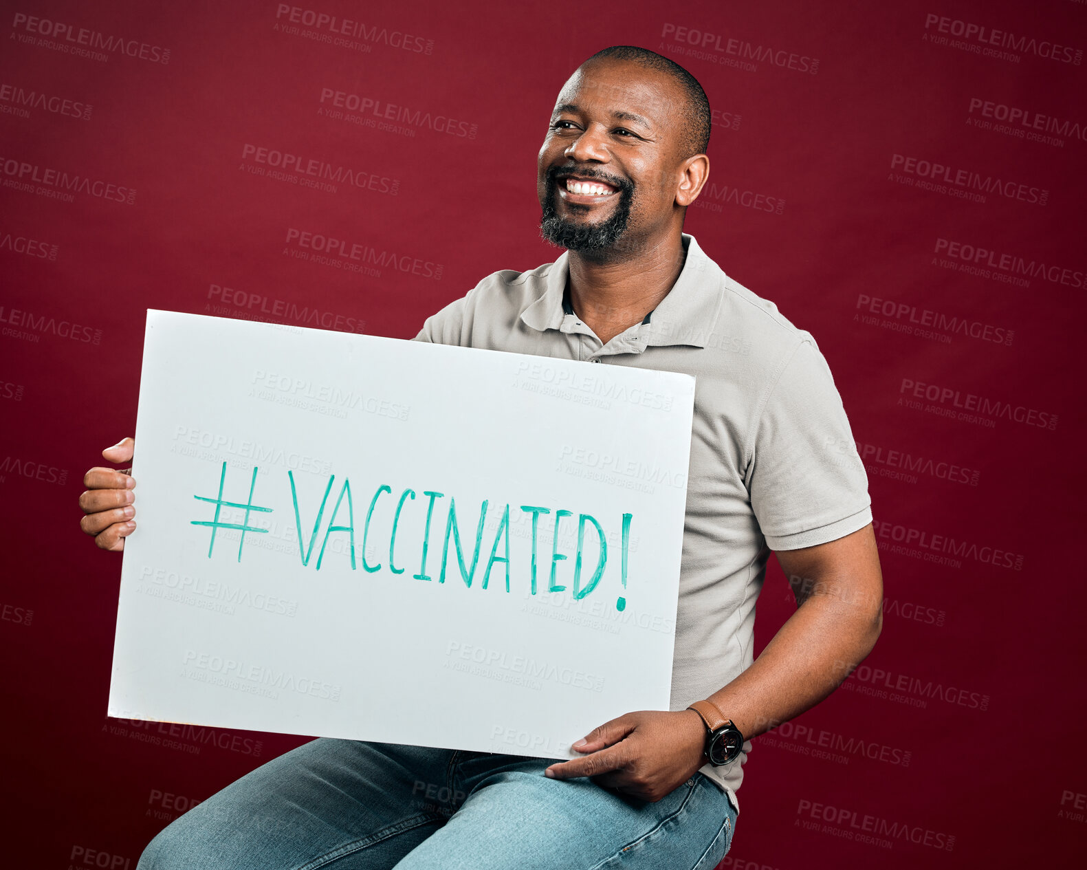 Buy stock photo Poster, thinking and vaccine with mature man in studio on red background for healthcare or medical. Hashtag, social media and smile of black person holding sign for covid awareness or prevention