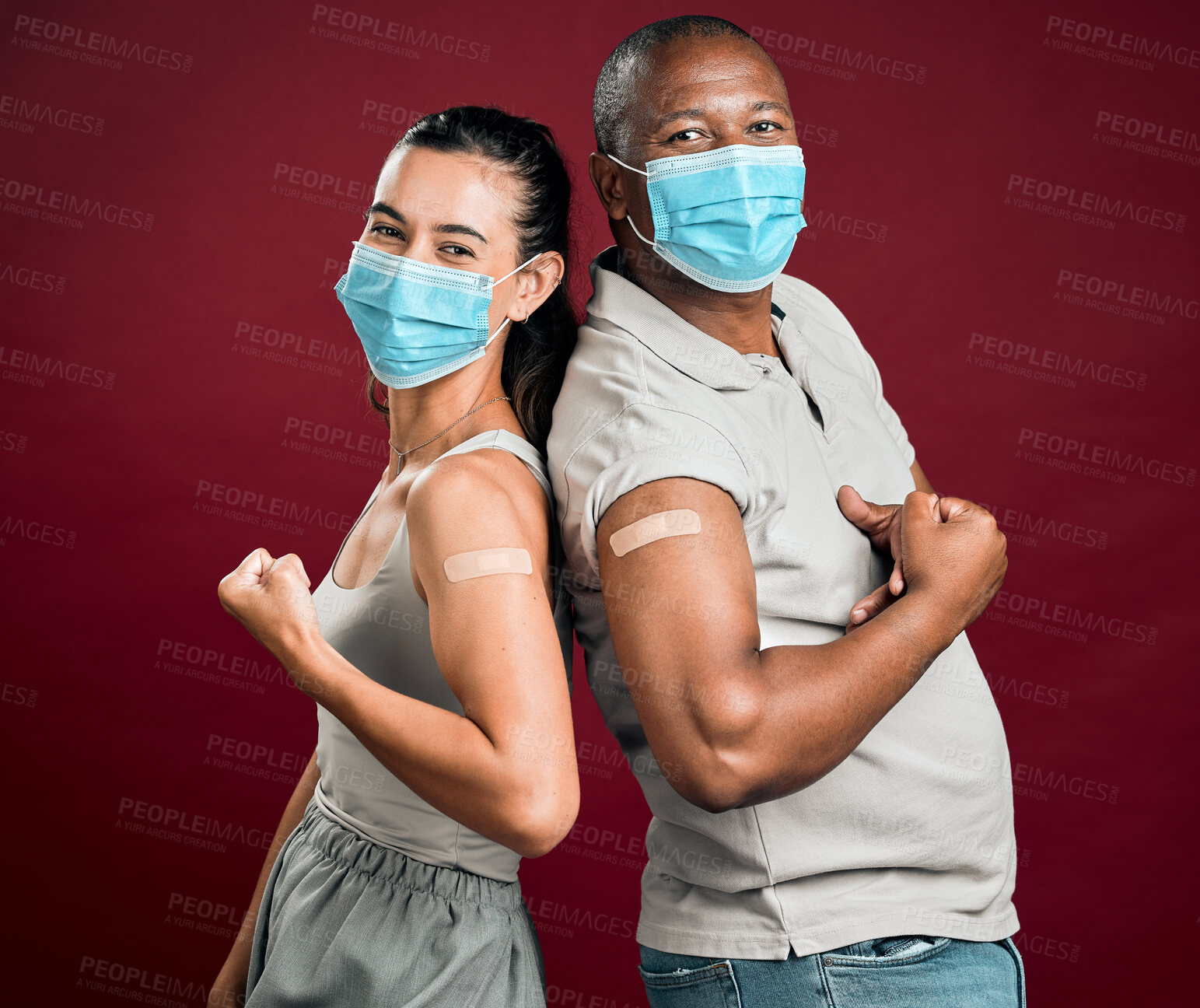 Buy stock photo Portrait, people and strong with face mask for vaccine in studio, healthcare compliance and medical insurance. Patient, muscle pride and plaster of virus injection, medicine safety and red background