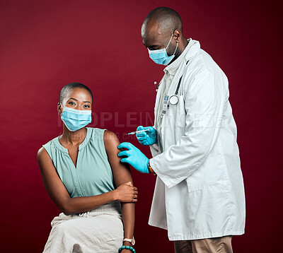 Buy stock photo Covid vaccine, needle and African doctor with black woman, health or wellness for pandemic safety. Patient, protection and drug for corona, risk control or disease treatment on red studio background