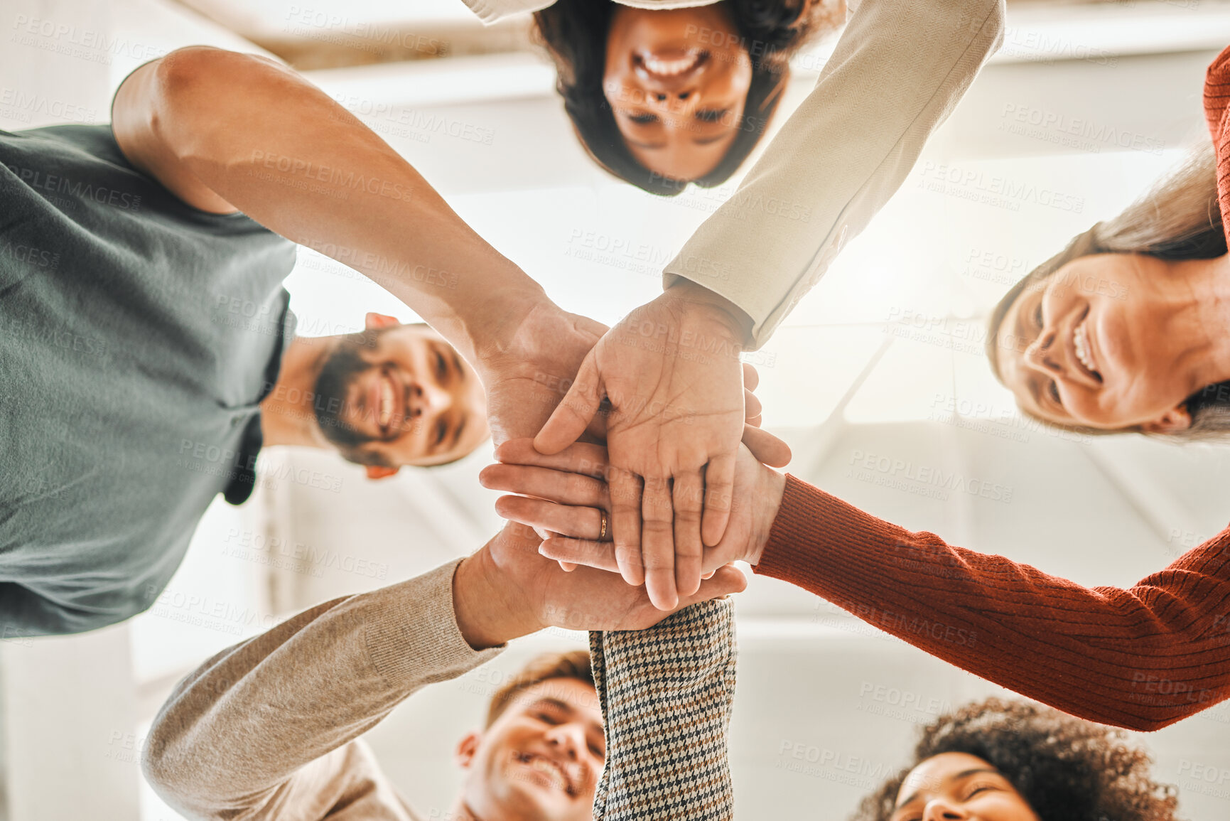 Buy stock photo Business people, hands and stack in office for solidarity, low angle and team building. Employees, group united and workplace for collaboration at agency, company mission and motivation for growth