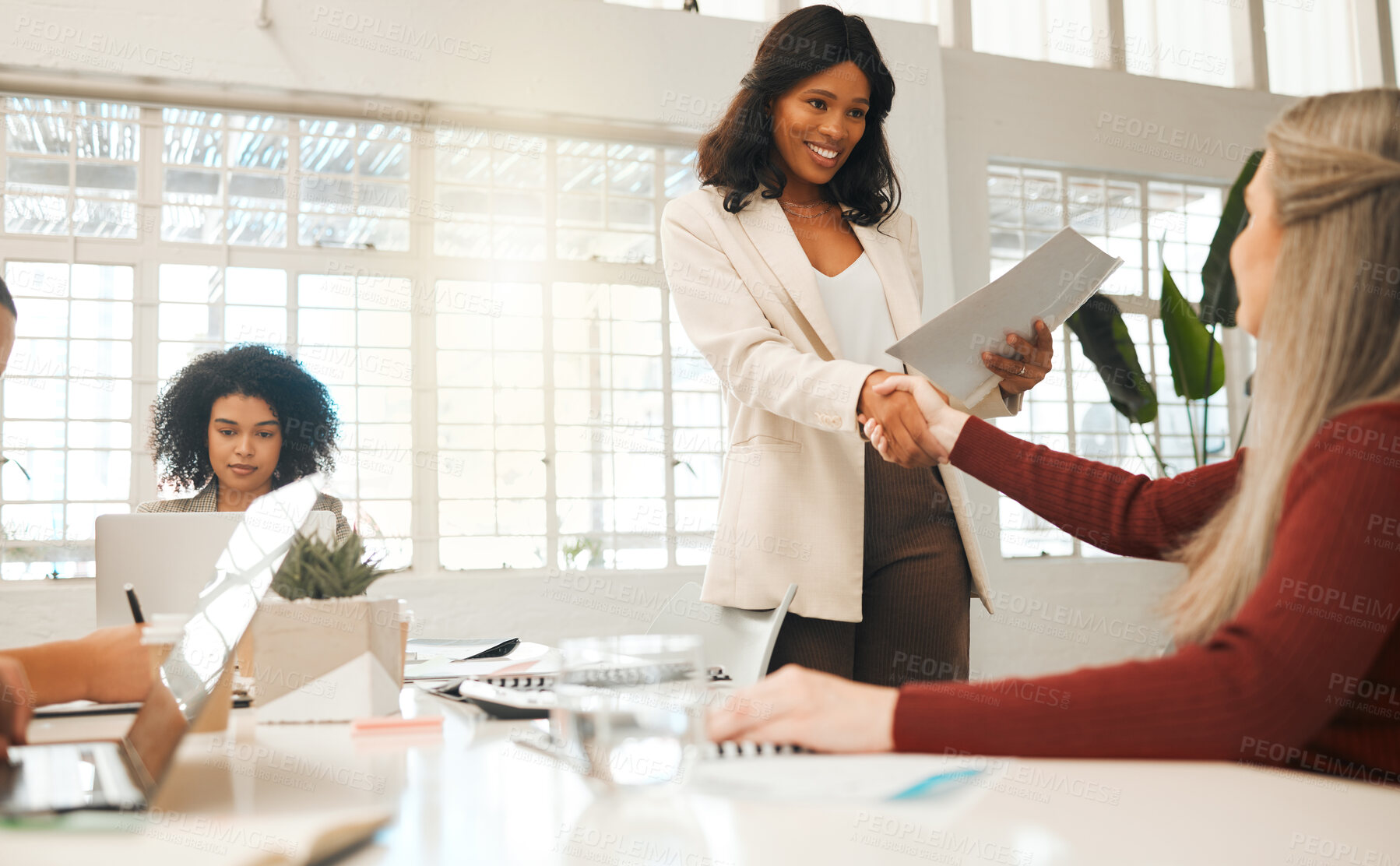 Buy stock photo Business women, meeting and handshake with partnership for recruiting, agreement or deal at office. Female people, employees or colleagues shaking hands for job hiring or introduction at workplace