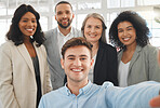 Portrait of a group of five cheerful diverse and positive businesspeople taking a selfie together at work. Young happy caucasian businessman taking a photo with his joyful colleagues. Coworkers bonding in an office