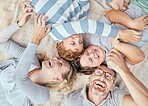 Carefree loving parents from above tickling and teasing their cute little laughing sons. Happy caucasian family of four relaxing and playing together. Cheerful kids spending quality time with mom and dad