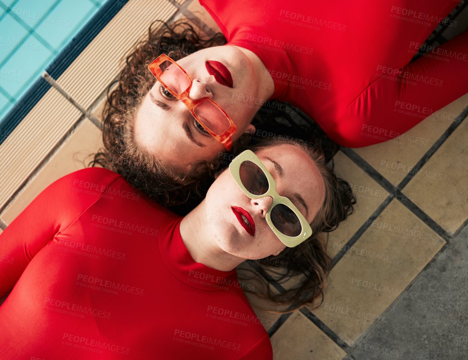 Buy stock photo Women, sunglasses and urban fashion at a pool with gen z, hipster and style of girl friends with top view. Red clothing, cool and trendy glasses with young people on a floor with student model