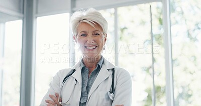 Buy stock photo Doctor, portrait and senior woman with arms crossed in hospital, happy and confident about healthcare service. Face, smile and lady health expert with stethoscope at clinic for help, trust or care