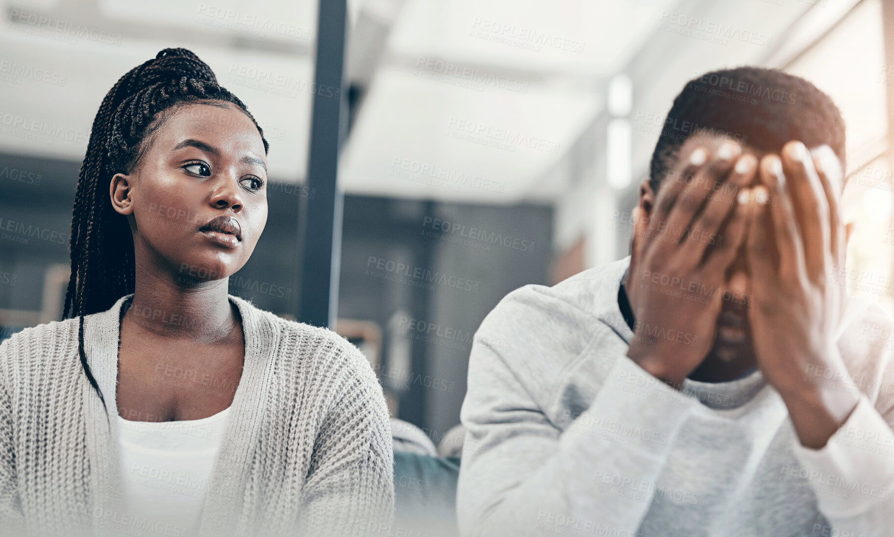 Buy stock photo Home, black couple and argument with stress on sofa in living room, upset or hurt. People, apartment and relationship with fighting, break up and separation with guilt, conflict and frustrated