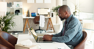 Buy stock photo Laptop, medical and typing with doctor black man in office of hospital for healthcare research. Computer, review and stethoscope with mature medicine professional at desk in clinic for cardiology