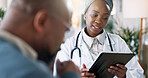 Black woman, doctor or tablet with patient for consultation, appointment or health advice at clinic. Young African, female person or medical employee with client on technology for checkup at hospital