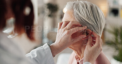 Buy stock photo Doctor, senior woman and consultation for hearing aid with geriatric support, tinnitus and help for sound waves. Ent, otolaryngology and patient with cochlear implant for healthcare and auditory tech