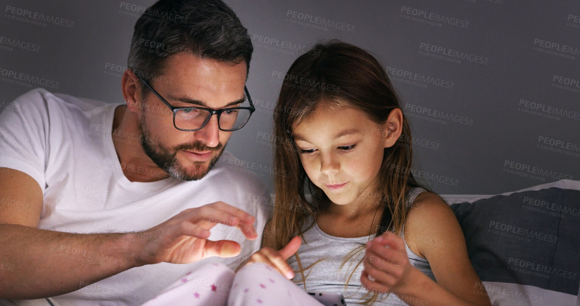 Buy stock photo Tablet, father and kid in bedroom for learning, education or storytelling in family home at night. Dad, girl and child on digital technology for help with online app, reading ebook or streaming movie