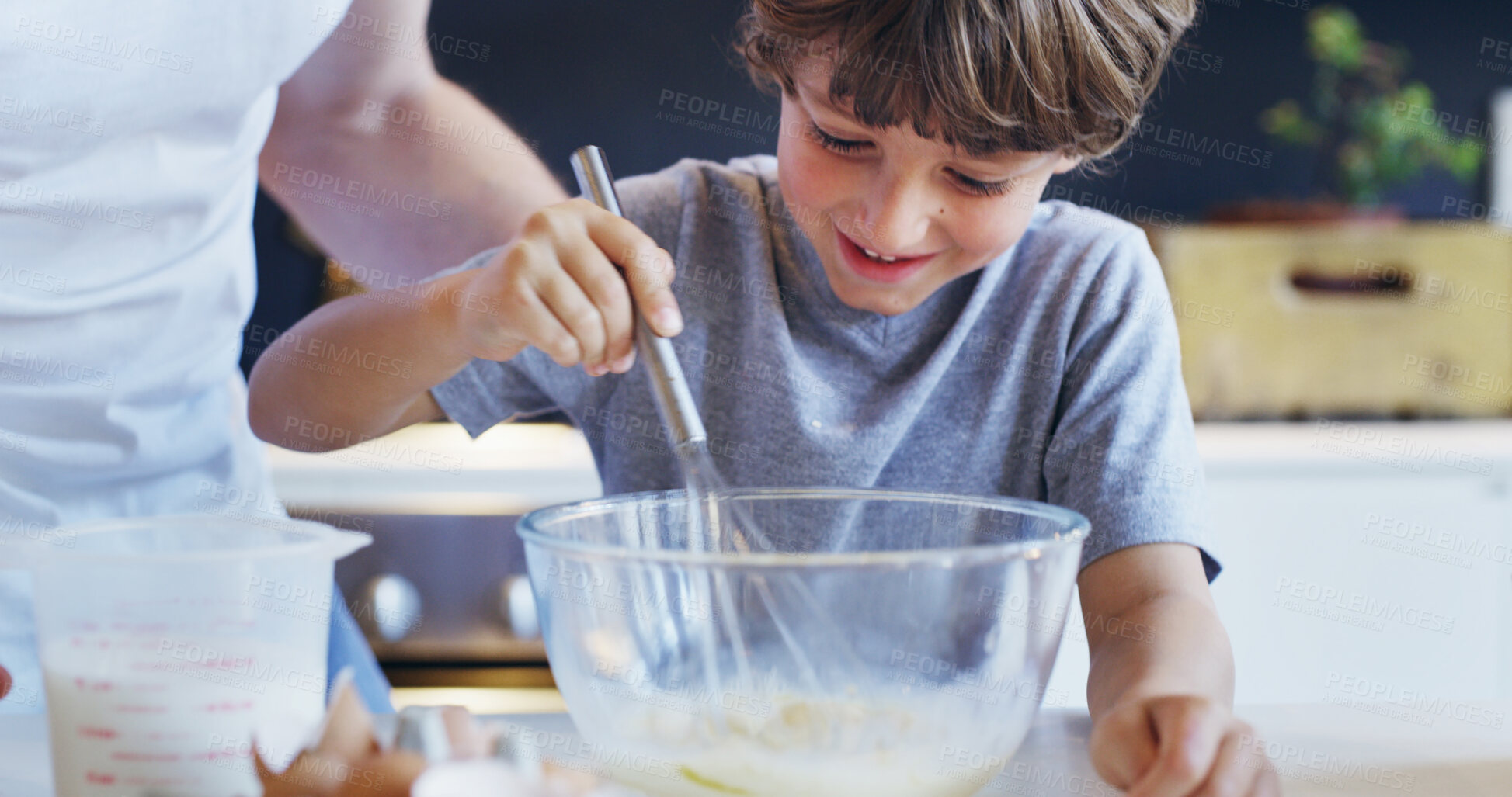 Buy stock photo Child, whisk and kitchen baking with parent help, support and love in family home with cooking. Learning, boy and bowl for cake with bonding, smile and youth development with ingredients and dessert