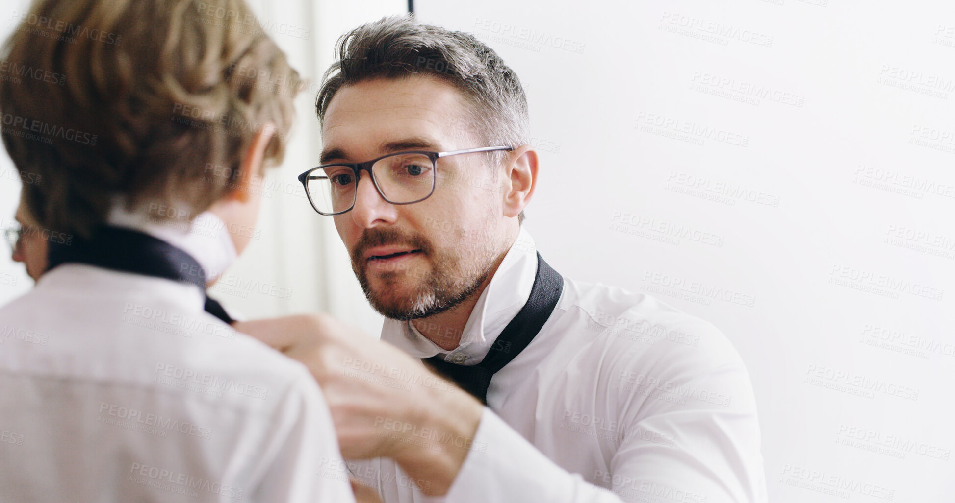 Buy stock photo Father, kid and help with necktie in home for event preparation, learning fashion and family together. Dad, child and boy in formal tie, fix clothes and dressing or wear with parent getting ready