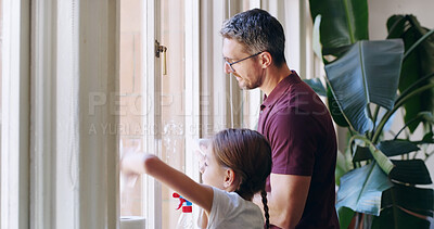 Buy stock photo Cleaning window, home and father with girl, help and bonding together in living room. Family, apartment and single parent with daughter, kid and childhood with chores, housekeeping and routine