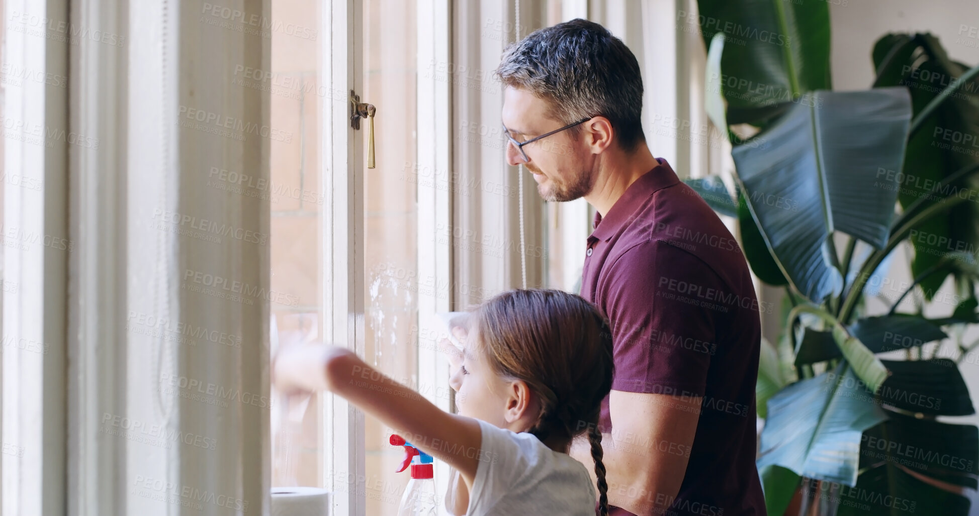 Buy stock photo Cleaning window, home and father with girl, help and bonding together in living room. Family, apartment and single parent with daughter, kid and childhood with chores, housekeeping and routine