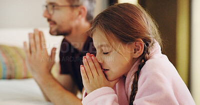 Buy stock photo Child, man and religion with praying on bed together in home for bedtime faith or worship. Belief, gratitude or trust with daughter and single parent dad in prayer to God or Jesus at apartment