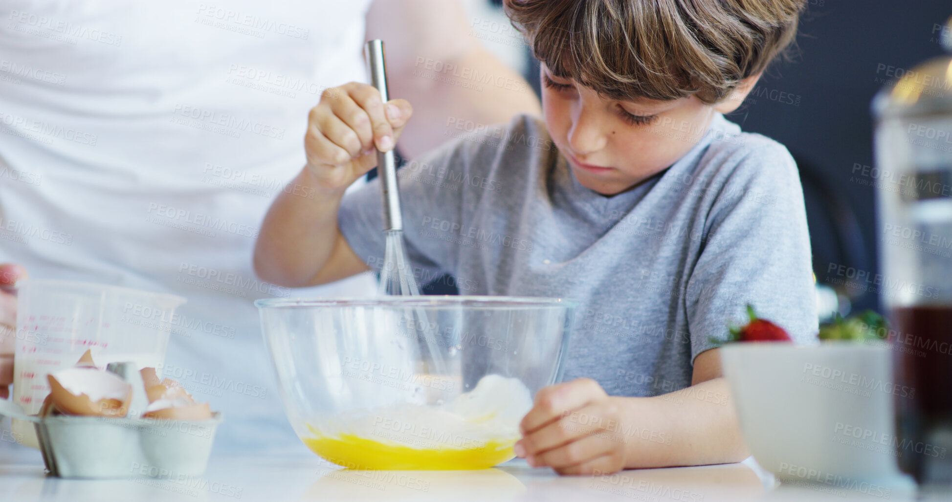 Buy stock photo Child, baking whisk and kitchen with parent help, support and love in family home with cooking. Learning, boy and bowl for cake with bonding, eggs and youth development with ingredients and dessert