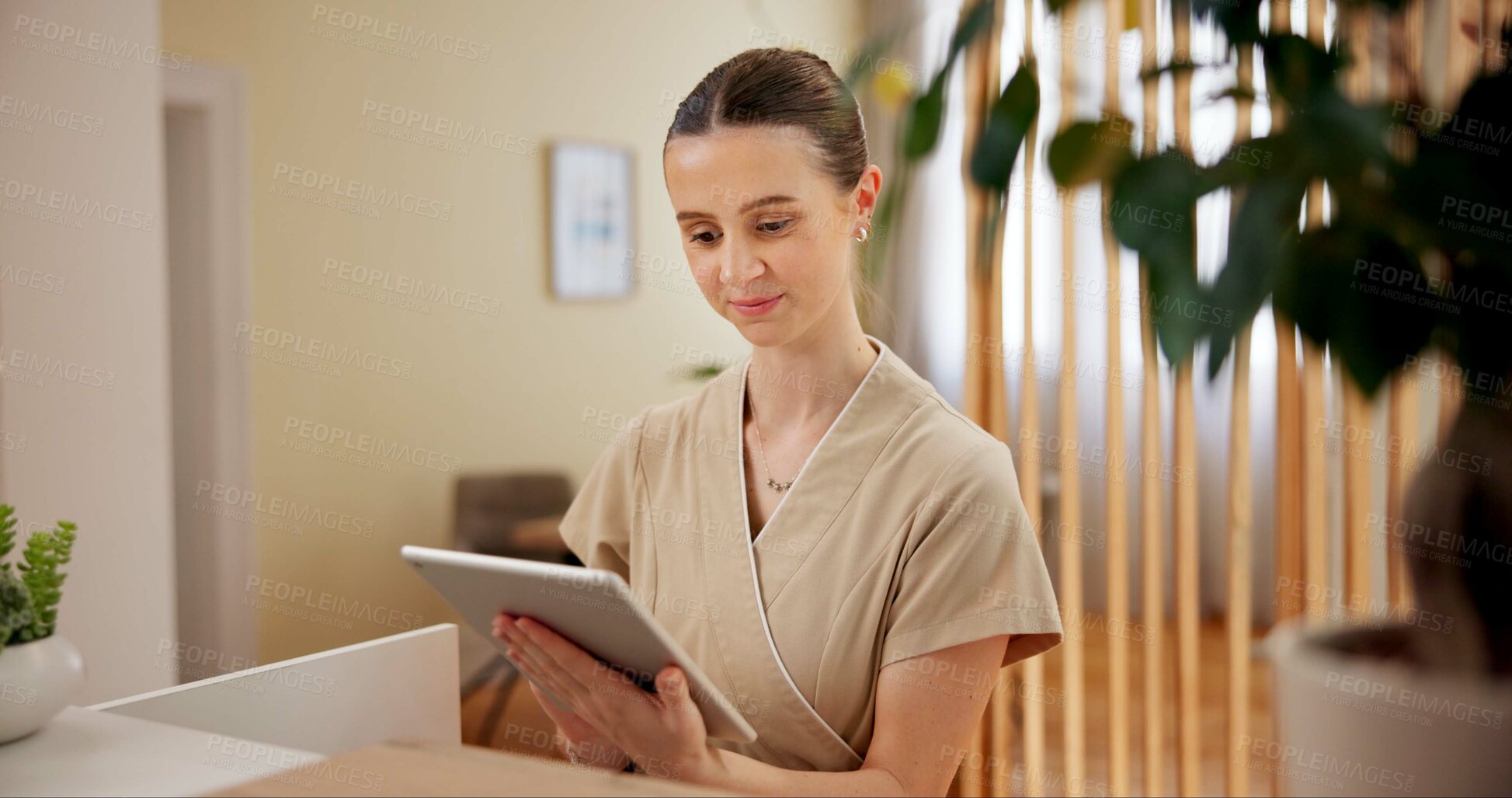 Buy stock photo Beauty, spa and woman at reception with tablet checking website for online booking schedule. Consultant, receptionist or girl at front desk with digital app for appointment at luxury hotel salon.