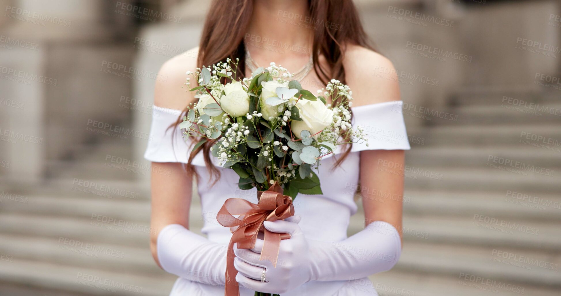 Buy stock photo Hands, woman and flowers with wedding in city for love, happy and white dress for celebration in street by court. Bride, person and bouquet for event, marriage or milestone on metro sidewalk in Italy