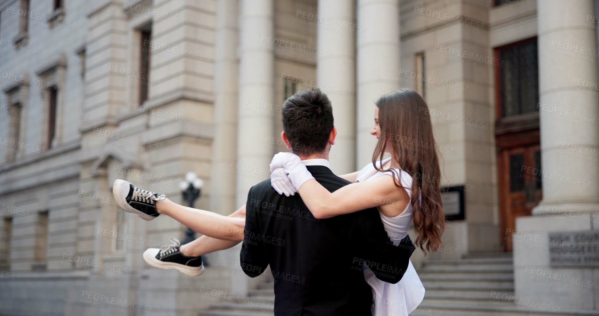 Buy stock photo Wedding, carry and couple in city for love at marriage ceremony, celebration and court certificate. Romance, bride and groom and back of man and woman in town for commitment, partnership and promise