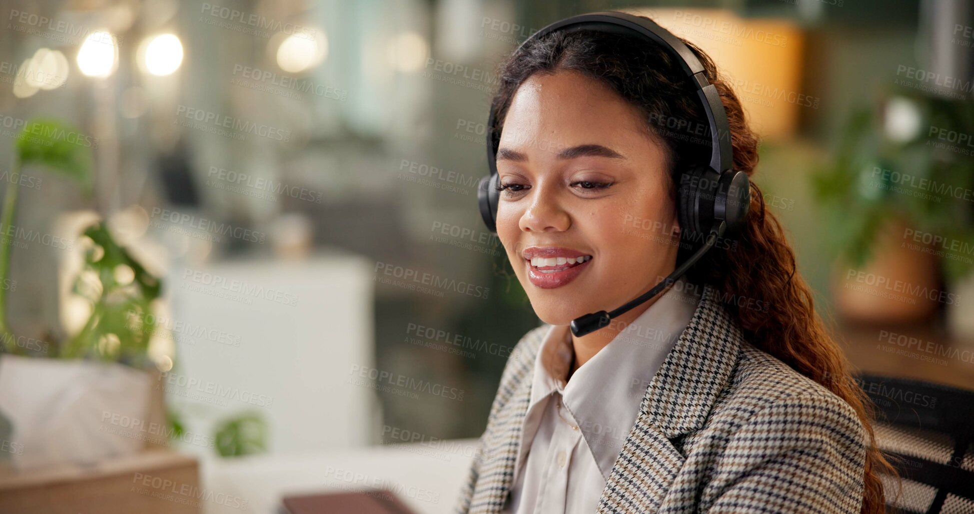 Buy stock photo Woman, call center and happy at night, headphones and mic with customer support, crm and advice in office. Person, agent and consultant with voip, thinking or overtime with telemarketing at workplace