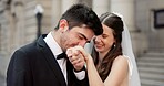 Smile, couple and kiss on hand for wedding with promise, celebration and marriage commitment. Happy, people and love with affection for partnership, relationship loyalty and romance ceremony at court