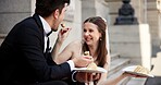 City, love and couple at wedding with cake, smile and happy bride with groom in street together. Urban romance, man and woman at court marriage event, eating or sharing dessert at outdoor celebration