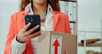 Business woman, hands and box with phone in logistics for online order, delivery or courier service at warehouse. Closeup, female person or distributor on mobile smartphone for package or shipment