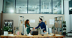 Man, woman and handshake in warehouse with boxes, deal and b2b agreement with teamwork for logistics. People, shaking hands and inventory with welcome, collaboration and packaging for supply chain