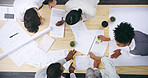 Top view, business people and team meeting for architecture, discussion or floor plan in creative startup. Group, above or brainstorming ideas for construction project, renovation or blueprint design