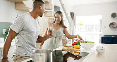 Buy stock photo Cooking, fun and couple in kitchen, singing and bonding with food, meal prep or laughing in home. Date, goofy and man with spoon, funny and silly for romance, celebration or happy with woman in house