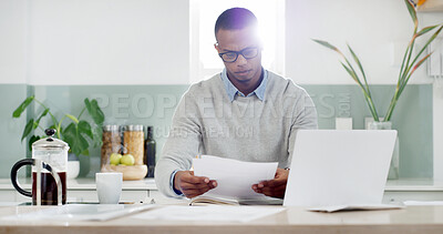Buy stock photo Man, paper and reading in kitchen for budget, planning and savings account with financial stress at tech. Person, glasses and invoice bills at table for home expenses, tax or anxiety for loan payment