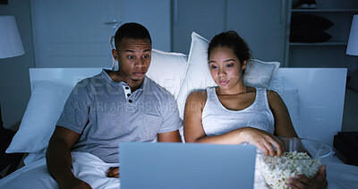 Buy stock photo Couple, watching and night with laptop at house for horror movie, eating popcorn and bonding together. Shock, people and relaxing on date with online streaming, scary film and entertainment services