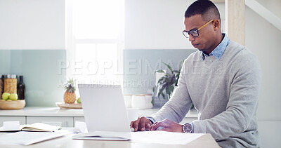 Buy stock photo Man, laptop and paperwork in kitchen for insurance review, mortgage documents and bills in home. Guy, computer and online accounting with asset management, tax registration and budget spreadsheet