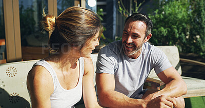 Buy stock photo Relax, happy couple and talking outdoor for love, care and story on sofa in backyard by house. Mature man, woman and conversation together for relationship, connection or communication with partner