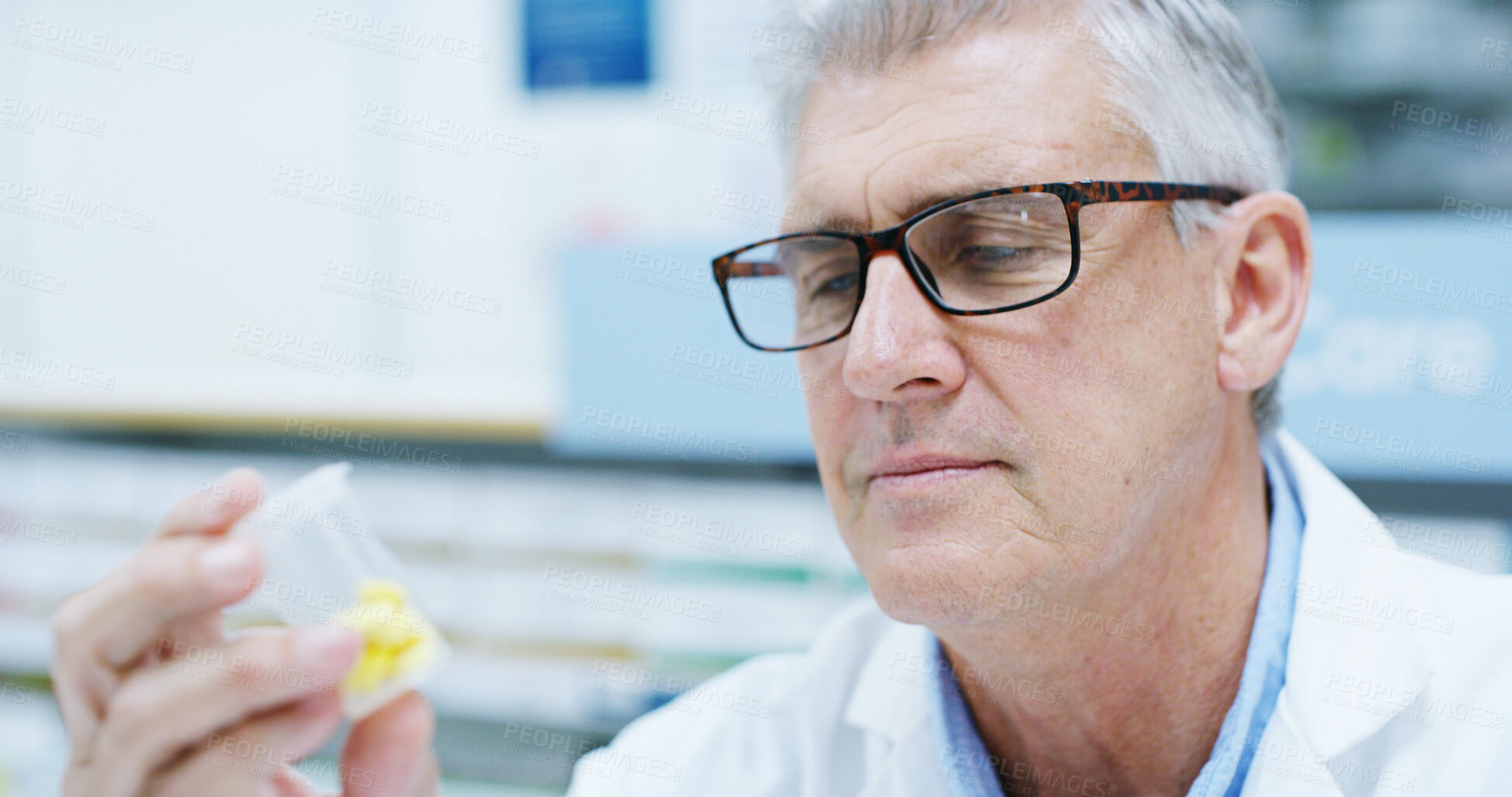 Buy stock photo Senior man, pharmacist and bottle with reading, pills or info with thinking for wellness at store. Person, container and inspection at shop, dispensary or check label with product for health benefits