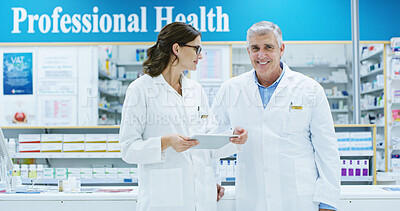 Buy stock photo Collaboration, healthcare and tablet with people in pharmacy together for medical discussion. Conversation, information or research with pharmacist man and woman in clinic for retail wellness