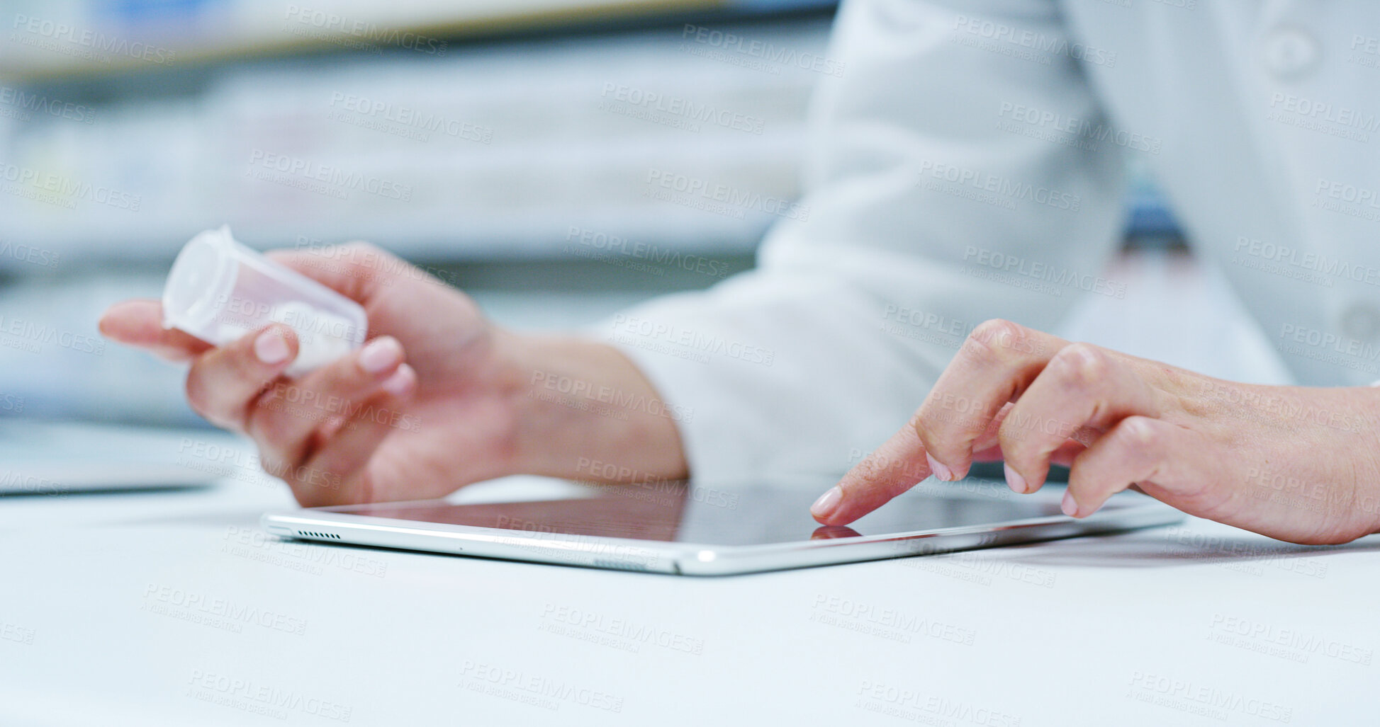 Buy stock photo Doctor, hands and tablet with medication for medical research, side effects or symptoms at pharmacy. Closeup, pharmacist or healthcare worker with technology or pills for pharmaceutical information