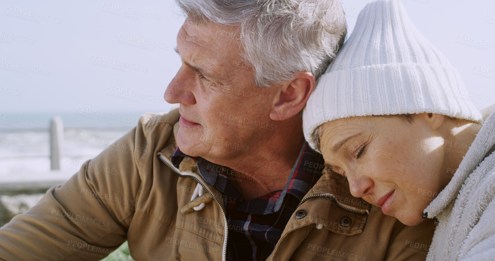 Buy stock photo Mature couple, love and thinking at ocean with depression, sadness and emotional support for loss. Mental health, senior people and empathy at seaside with trust, heartbreak and mourning bad news