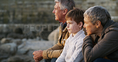 Buy stock photo Grandparents, grandchild and relax with view of beach for family holiday, happy memory and travel adventure. Senior people, boy child and sea scenery for connection, bonding and sightseeing nature