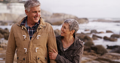 Buy stock photo Happy, walking and mature couple by ocean for bonding, relationship and love in nature. Retirement, marriage and man and woman by sea talking for romance, commitment and relax together on weekend