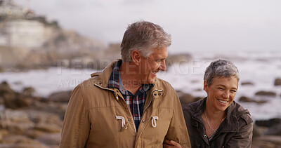 Buy stock photo Laugh, holding hands and mature couple by ocean for bonding, relationship and conversation. Love, marriage and man and woman by sea walking for romance, commitment and relax together on weekend