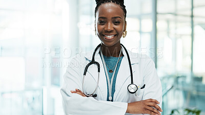 Buy stock photo Black woman, doctor and smile with arms crossed at hospital for medical service in Uganda. Female person, portrait and happy or proud in confidence for career growth, healthcare and treatment