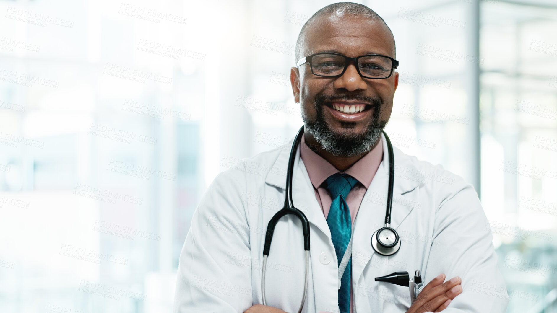 Buy stock photo Black man, doctor and happy with arms crossed at hospital for medical service in Uganda. Mature person, portrait and proud as employee in confidence for career growth, healthcare and treatment