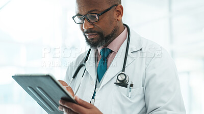 Buy stock photo Black man, tablet and doctor for healthcare at clinic with medical research, Telehealth and surgery schedule. Male surgeon, reading and digital with history report, patient information and diagnosis