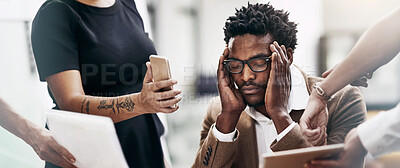 Buy stock photo Cropped shot of a stressed out businessman surrounded by colleagues needing help in an office